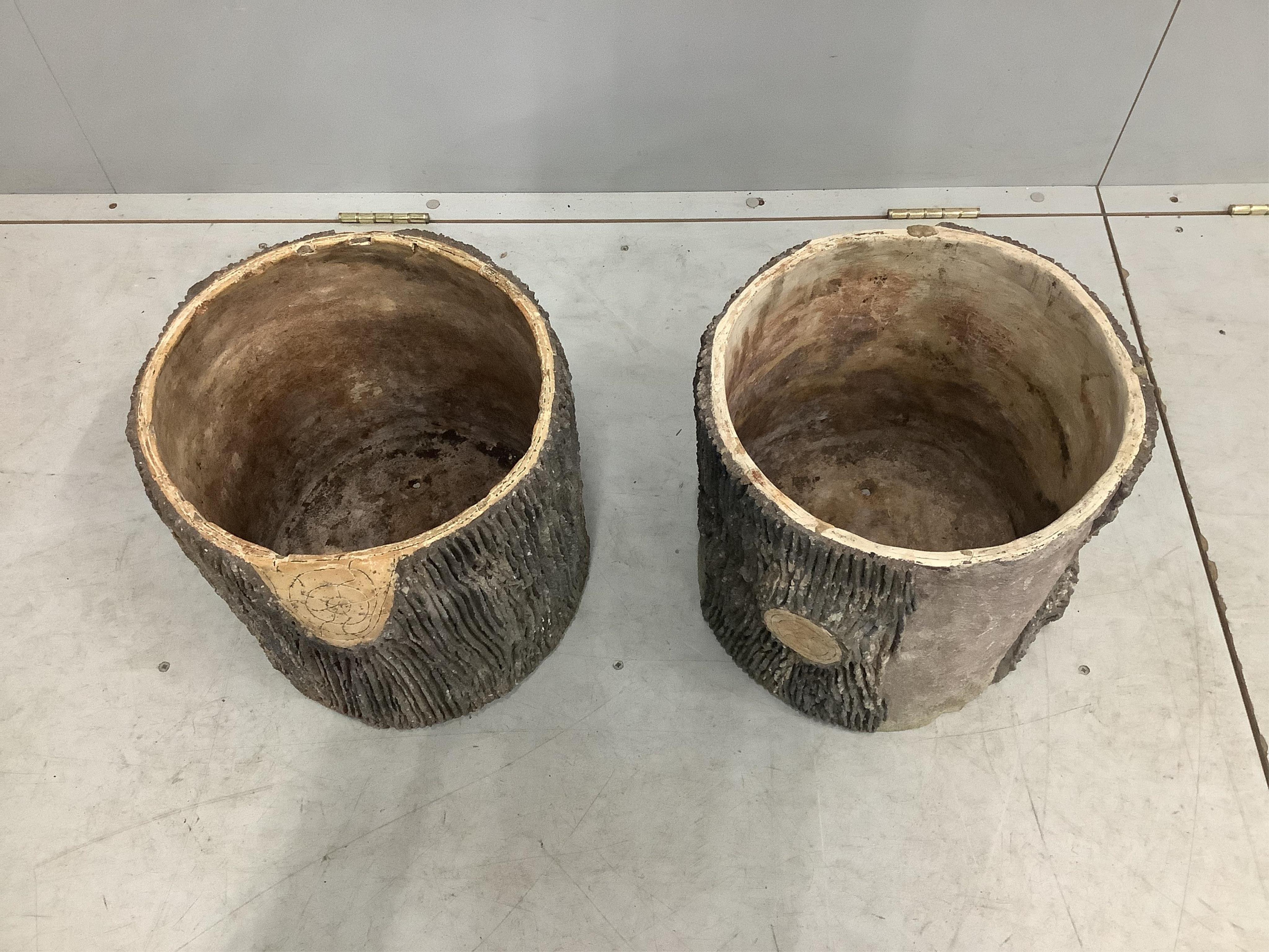 A pair of circular earthenware log effect planters, diameter 33cm, height 32cm. Condition - fair